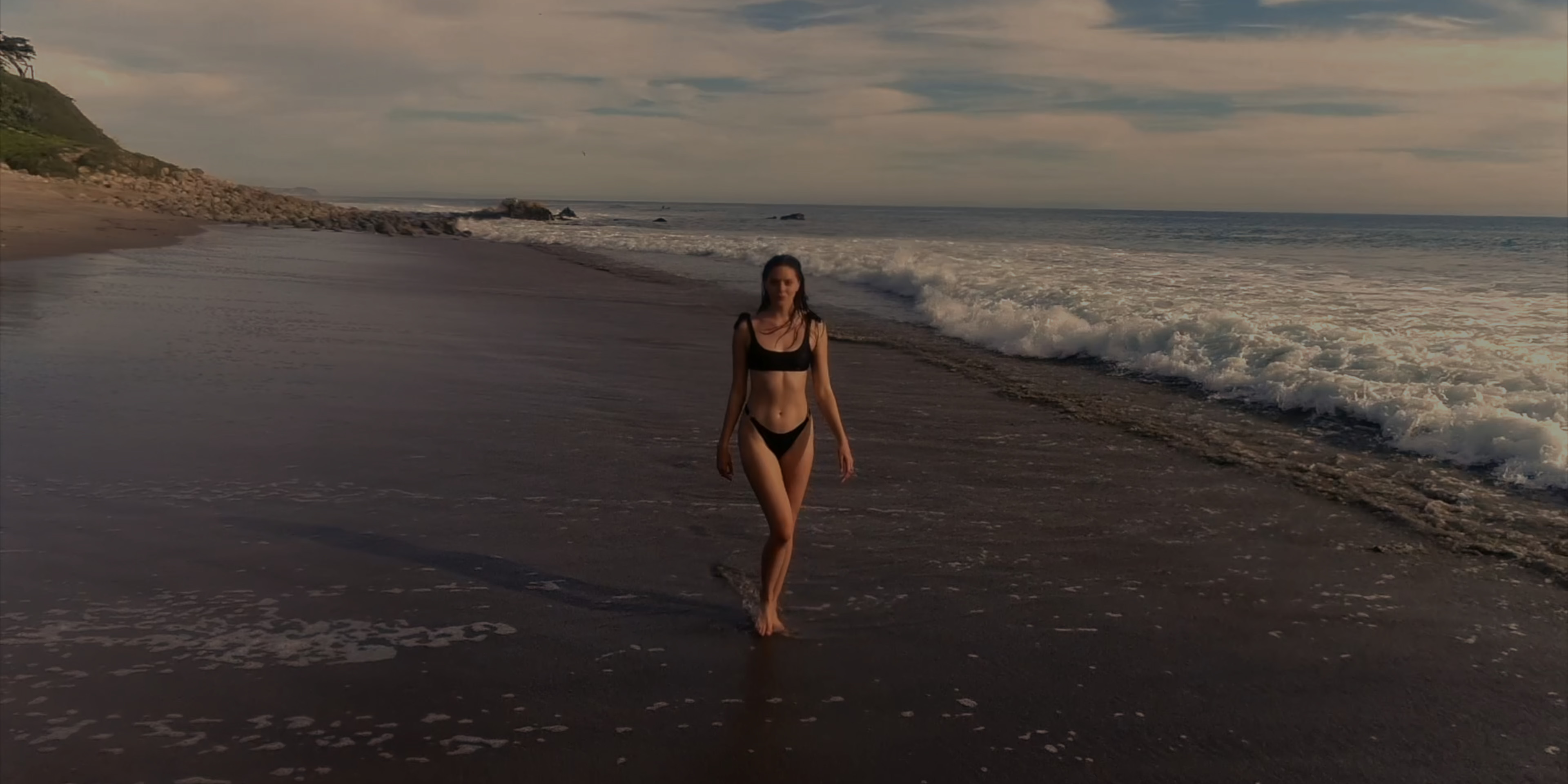 Lindsey Savchuk walking along the beach